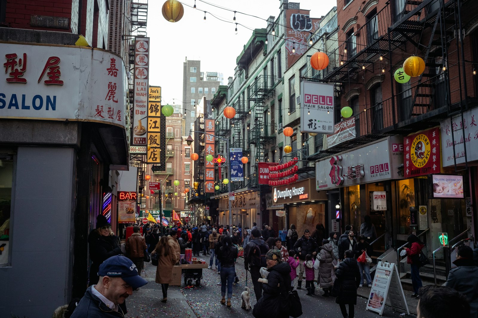 Chinatown street with red lanterns and shop signs
